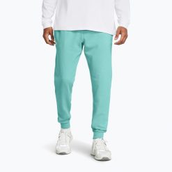 Spodnie męskie Under Armour Rival Fleece Joggers. Niebieskie joggery i bojówki Under Armour, m, bez wzorów, sportowe. Za 209.99 zł.