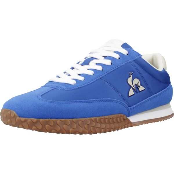 Buty LE COQ SPORTIF VELOCE I Niebieski. Niebieskie buty trekkingowe le coq sportif, bez wzorów, ze skóry, bez zapięcia. Za 313.99 zł.