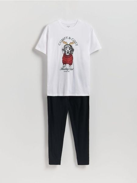 Dwuczęściowa piżama ze świątecznym motywem - biały. Białe piżamy Reserved, l, bez wzorów, z bawełny, bez ramiączek. W wyprzedaży za 35.99 zł.