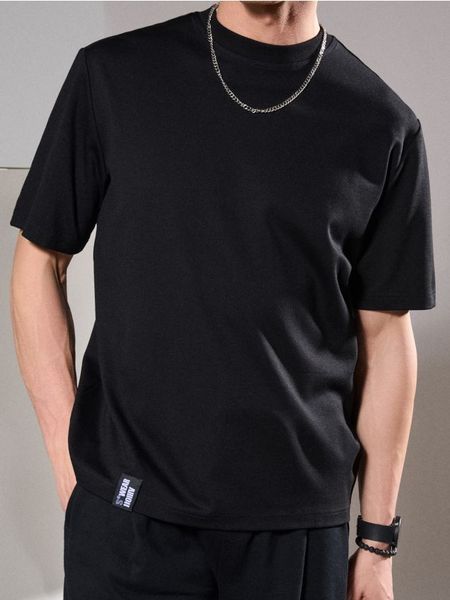Bluza z krótkim rękawem - czarny. Czarne bluzy bez kaptura Sinsay, l, bez wzorów, bez kaptura. W wyprzedaży za 19.99 zł.