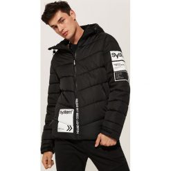 Pikowana kurtka z nadrukami - Czarny. Kurtki marki B'TWIN. Za 229.99 zł.