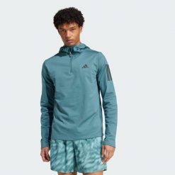 Bluza z kapturem Own The Run Winterized Hooded Half-Zip. Niebieskie bluzy Adidas, s, bez wzorów, z kapturem. Za 279.99 zł.