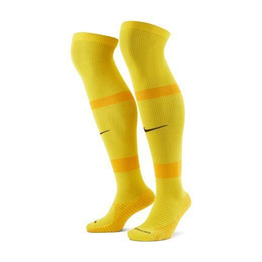 Skarpety piłkarskie Nike MatchFit CV1956-719. Żółte legginsy długie sportowe Nike, bez wzorów, z materiału. Za 75.70 zł.