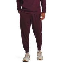 Spodnie dresowe męskie Under Armour Fleece Joggers. Czerwone joggery i bojówki Under Armour, m, bez wzorów, z dresówki, sportowe. Za 179.99 zł.