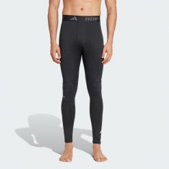 Legginsy TECHFIT COLD.RDY Training Long. Czarne legginsy długie sportowe Adidas, s, bez wzorów, z materiału, na fitness i siłownię, techfit (adidas). Za 224.60 zł.