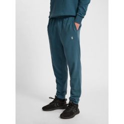 Spodnie dresowe Hummel Pulse. Niebieskie buty treningowe Hummel, bez wzorów, z dresówki, na fitness i siłownię. Za 155.00 zł.