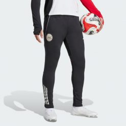 Spodnie treningowe Ajax Amsterdam Tiro 25 Competition. Białe spodnie treningowe długie Adidas, l, bez wzorów, z dresówki. Za 279.00 zł.