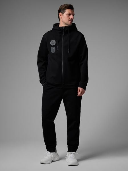 4F Spodnie dresowe joggery męskie 4F x Robert Lewandowski - czarne XXL. Czarne joggery i bojówki 4F, m, bez wzorów, z bawełny, sportowe. Za 189.99 zł.