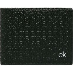 Calvin Klein - Portfel skórzany. Czarne portfele CALVIN KLEIN, bez wzorów, z materiału. W wyprzedaży za 199.90 zł.