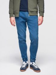 Spodnie męskie jeansowe joggery ze ściagaczem w pasie - niebieskie V1 - Rozmiar: XL. Niebieskie joggery i bojówki Ombre Clothing, na co dzień, m, z aplikacjami, z bawełny, retro. Za 239.99 zł.