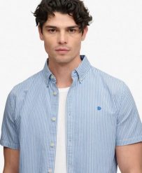 Superdry Koszula Preppy Oxford z krótkim rękawem - Bawełna organiczna – Sky. Niebieskie koszule Superdry, l, bez wzorów, z bawełny, bez kołnierzyka, bez ramiączek. Za 280.40 zł.