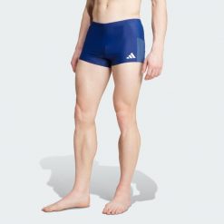 Bokserki do pływania z kontrastowym zestawieniem kolorów. Niebieskie bokserki Adidas, bez wzorów. Za 129.00 zł.