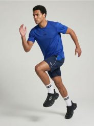 Szorty sportowe SNSY PERFORMANCE - granatowy. Niebieskie krótkie spodenki sportowe Sinsay, l, bez wzorów. Za 39.99 zł.