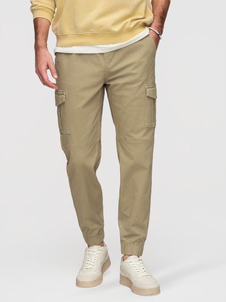 Spodnie męskie JOGGERY z zapinanymi kieszeniami cargo - khaki V1. Zielone joggery i bojówki Ombre Clothing, do pracy, m, bez wzorów, z bawełny, biznesowe. Za 249.99 zł.