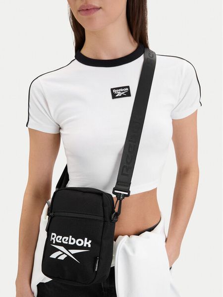 Reebok Saszetka CWBEO-RBK-010-CCC-06 Czarny. Czarne saszetki i nerki Reebok, bez wzorów, z materiału, bez dodatków. Za 49.99 zł.