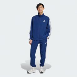 Dres Sportswear Basic 3-Stripes Woven. Niebieskie komplety dresowe Adidas, xl, bez wzorów, z dresówki, bez ramiączek. Za 299.00 zł.