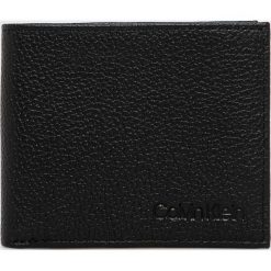 Calvin Klein - Portfel skórzany. Czarne portfele CALVIN KLEIN, bez wzorów, z materiału. W wyprzedaży za 159.90 zł.