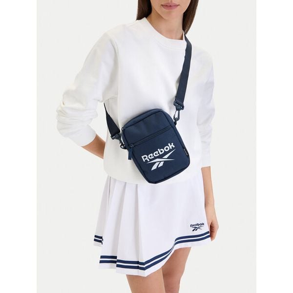 Saszetka Reebok. Niebieskie saszetki i nerki Reebok, bez wzorów, małe, bez dodatków. Za 49.99 zł.