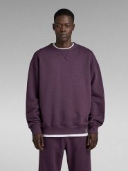 G-Star Sweter w kolorze fioletowym rozmiar: S. Różowe swetry nierozpinane G-Star, s, bez wzorów, z bawełny, bez kołnierzyka, bez ramiączek. Za 168.06 zł.