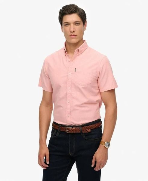 Superdry Koszula Oxford krótki rękaw Rose Pink Chambray z bawełny organicznej. Czerwone koszule Superdry, l, bez wzorów, z bawełny, bez kołnierzyka, bez ramiączek. Za 335.65 zł.