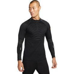 Bluza treningowa męska Nike Techfit Strike Drill Top Winter Warrior. Czarne bluzy Nike, m, bez wzorów, bez kaptura. W wyprzedaży za 170.15 zł.