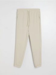 Spodnie jogger - beżowy. Brązowe joggery i bojówki Sinsay, l, bez wzorów. Za 49.99 zł.