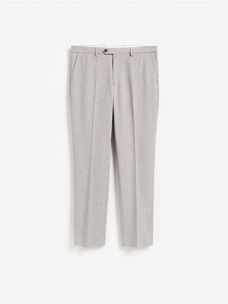 Spodnie garniturowe slim fit - brązowy. Brązowe garnitury Reserved, l, bez wzorów, z tkaniny. Za 169.99 zł.