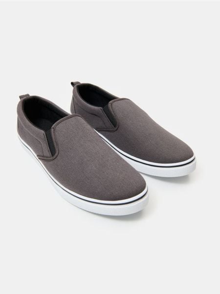 Trampki typu slip-on - szary. Szare trampki Sinsay, bez wzorów, bez zapięcia. Za 29.99 zł.