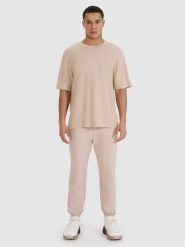 4F T-shirt oversize z modalem męski - beżowy XL. Brązowe t-shirty 4F, m, bez wzorów, z bawełny, bez kołnierzyka, bez ramiączek. W wyprzedaży za 59.99 zł.