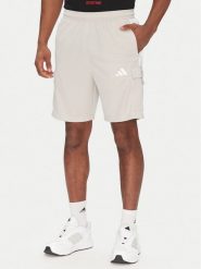 Adidas Szorty sportowe Tiro Cargo JC7958 Beżowy Regular Fit. Brązowe krótkie spodenki sportowe Adidas, l, bez wzorów, z syntetyku. Za 169.99 zł.