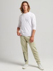 Superdry Spodnie dresowe w kolorze beżowym rozmiar: XXL. Brązowe spodnie treningowe długie Superdry, xxl, bez wzorów, z bawełny. Za 171.68 zł.