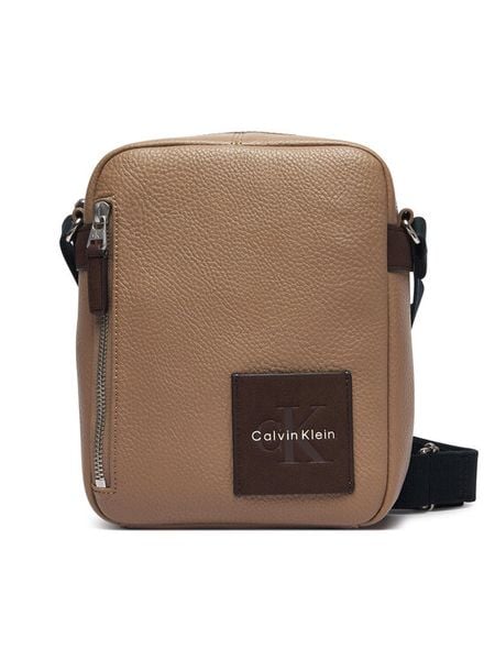Calvin Klein Saszetka Bold Pebble Ssnl Simple Reporter LV04D3624G Beżowy. Brązowe saszetki i nerki CALVIN KLEIN, bez wzorów, ze skóry. Za 369.99 zł.