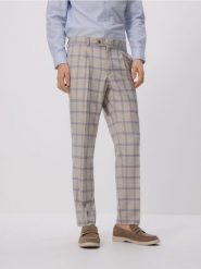 Garniturowe spodnie slim fit - beżowy. Brązowe garnitury Reserved, bez wzorów, z tkaniny. Za 169.99 zł.