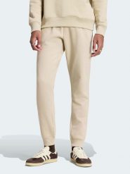 Adidas Spodnie dresowe w kolorze beżowym rozmiar: M. Brązowe spodnie treningowe długie Adidas, m, bez wzorów, z dresówki. Za 159.95 zł.