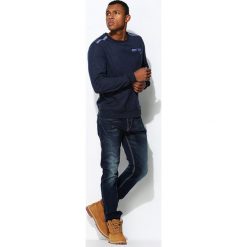 Granatowe Jeansy Bad Blood. Jeansy marki Under Armour. Za 54.99 zł.
