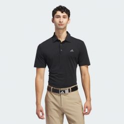 Koszulka polo Ultimate365 Solid. Czarne koszulki polo Adidas, m, bez wzorów, z materiału, bez kołnierzyka, bez ramiączek. W wyprzedaży za 231.00 zł.