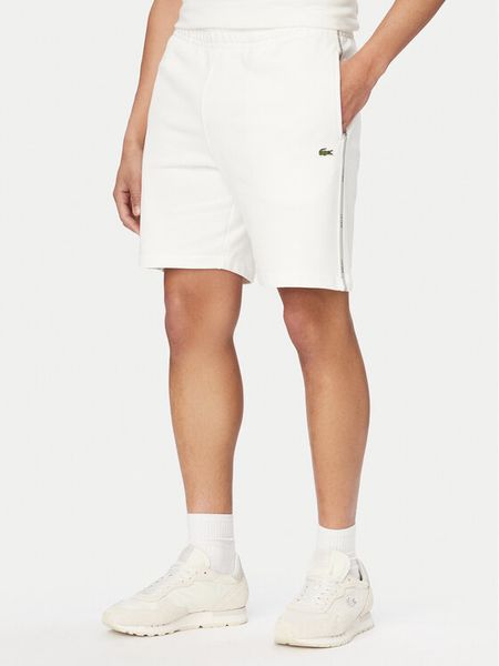 Lacoste Szorty sportowe GH0886 Biały Regular Fit. Białe krótkie spodenki sportowe LACOSTE, m, bez wzorów, z bawełny. Za 323.99 zł.