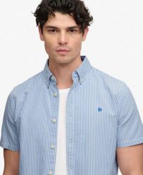 Superdry Koszula Preppy Oxford krótki rękaw – 100% Bawełna organiczna, luźny. Niebieskie koszule Superdry, xl, bez wzorów, z bawełny, bez kołnierzyka, bez ramiączek. Za 282.85 zł.