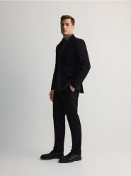 Garniturowe spodnie slim fit - czarny. Czarne garnitury Reserved, bez wzorów, z tkaniny. Za 149.99 zł.