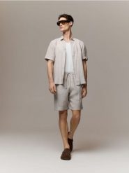 Lniana koszula slim fit - beżowy. Brązowe koszule Reserved, l, bez wzorów, z tkaniny, bez kołnierzyka, bez ramiączek. Za 159.99 zł.