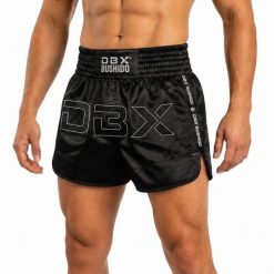 Spodenki tajskie męskie czarne V1 COMBATWEAR DBX Bushido. Czarne krótkie spodenki sportowe DBX BUSHIDO, l, bez wzorów, z żakardem. Za 239.99 zł.