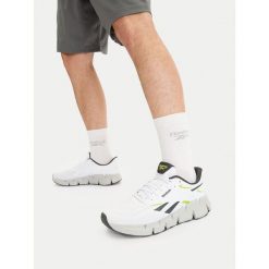 Buty do biegania Reebok. Białe buty do biegania Reebok, bez wzorów, bez zapięcia, do biegania. Za 329.99 zł.