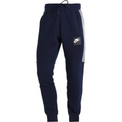 Nike Sportswear AIR JOGGER Spodnie treningowe obsidian/carbon heather/white. Joggery i bojówki marki Nike Sportswear. Za 249.00 zł.