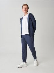 Spodnie dresowe jogger - granatowy. Niebieskie joggery i bojówki Sinsay, l, bez wzorów, z bawełny. Za 29.99 zł.