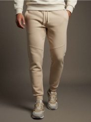 Spodnie jogger dresowe pique - beżowy. Brązowe joggery i bojówki Sinsay, l, bez wzorów, z dresówki. Za 49.99 zł.