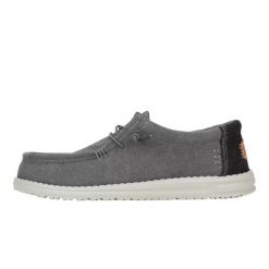 HeyDude Męskie Mokasyny Wally Workwear. Czarne mokasyny Hey dude, bez wzorów, z materiału, bez obcasa, bez zapięcia. Za 229.00 zł.