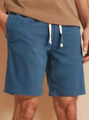 Szorty - niebieski. Niebieskie krótkie spodenki sportowe Sinsay, l, bez wzorów, z bawełny. Za 29.99 zł.