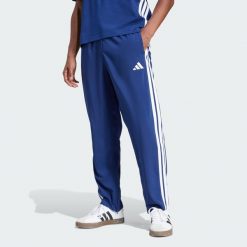 Spodnie Essentials 3-Stripes Stanford Open Hem. Brązowe spodnie treningowe długie Adidas, s, bez wzorów, z materiału. Za 179.00 zł.