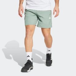 Spodenki fitness męskie ADIDAS. Zielone szorty Adidas, m, bez wzorów, z materiału, sportowe. W wyprzedaży za 99.99 zł.