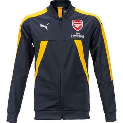 Kurtka "FC Arsenal" w kolorze granatowo-żółtym. Kurtki marki Puma. W wyprzedaży za 128.95 zł.